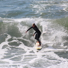 Surfing at Manhattan Beach Pier