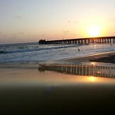 Muelle, sol, pequeñas olas, Elle Muelle de Ecuasal