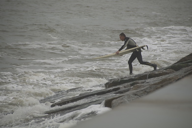 Jumping into the surf from Surfside Jetties-2-21-2015