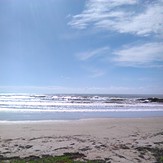 woolgoolga main beach with a bit of swell