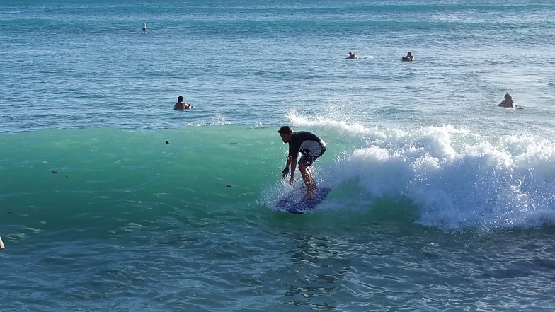 body sufer waikiki at the "wall" by Moana Anuenue