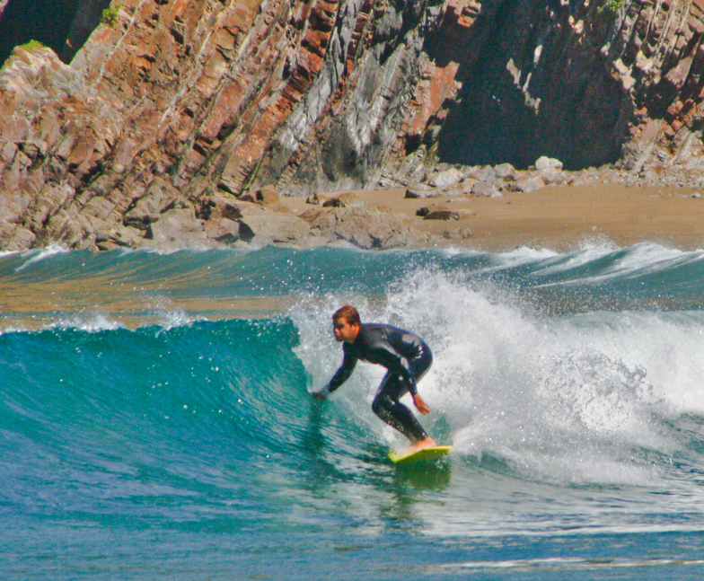Surfing in Playa de Cueva, Asturias, Spain