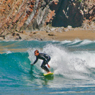 Surfing in Playa de Cueva, Asturias, Spain