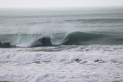 Going Deep, Wainui Beach - Stockroute photo