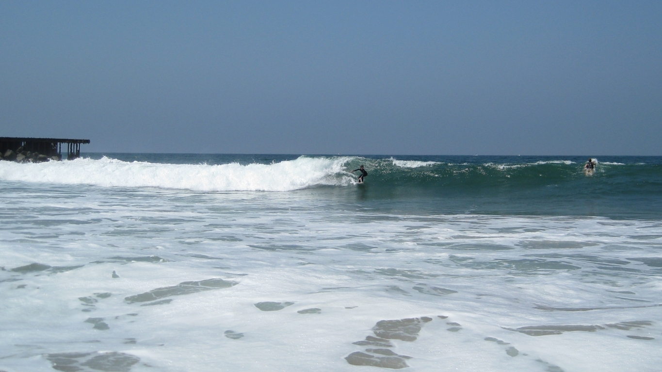 Surfer in wide view, Gillis