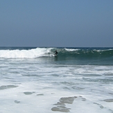 Surfer in wide view, Gillis