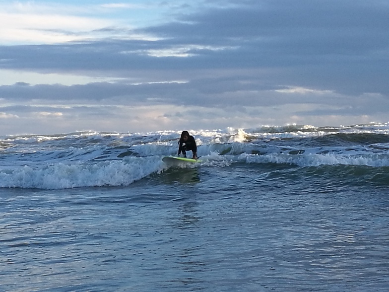 Surfing at Bethells, O'Neills Bay