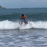 Emman Surfs the waves on Badoc Beach, Badoc Island Lefts