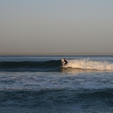 surfer at break near lifeguard tower 45, Gillis