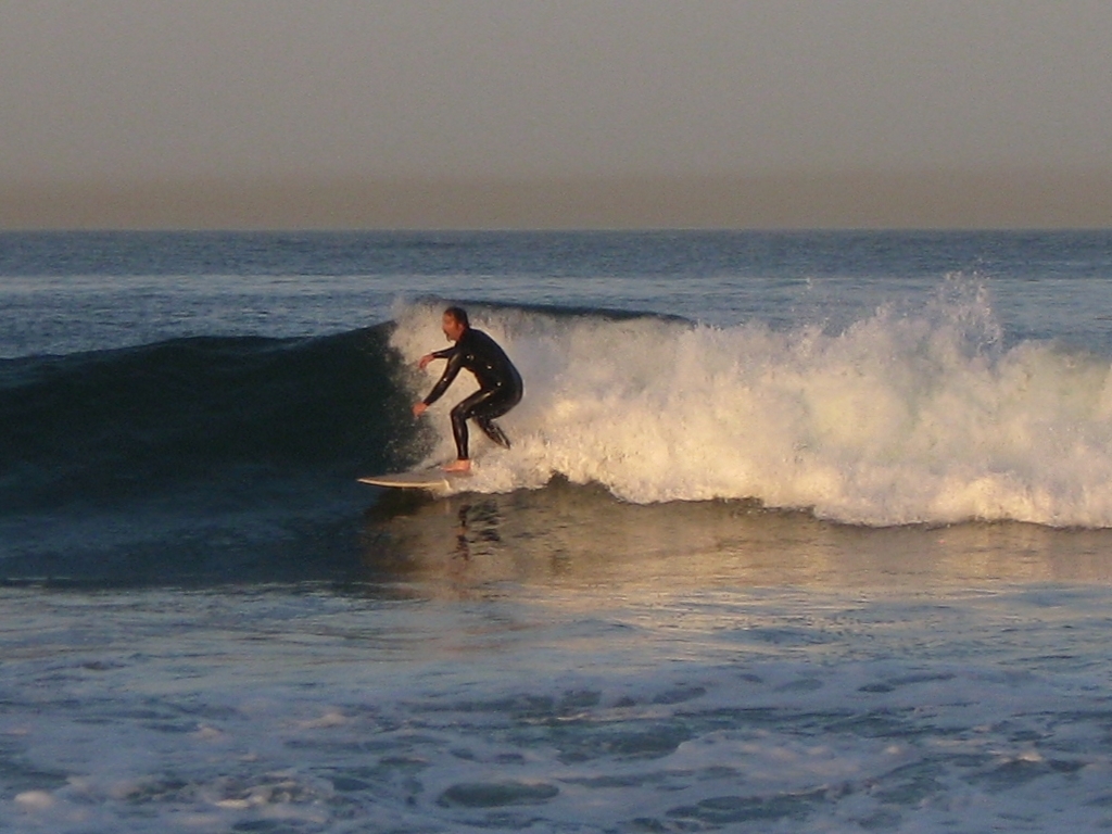 surfer at break near lifeguard tower 45 (cropped), Gillis