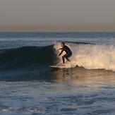 surfer at break near lifeguard tower 45 (cropped), Gillis