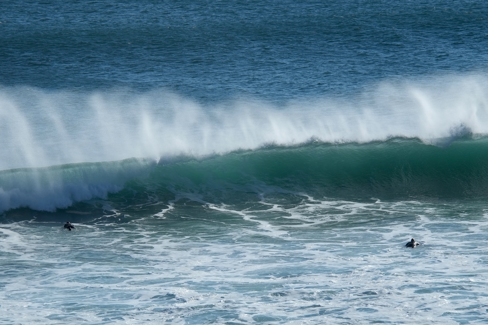 Two Robs paddle back out near Anatori, Anatori River