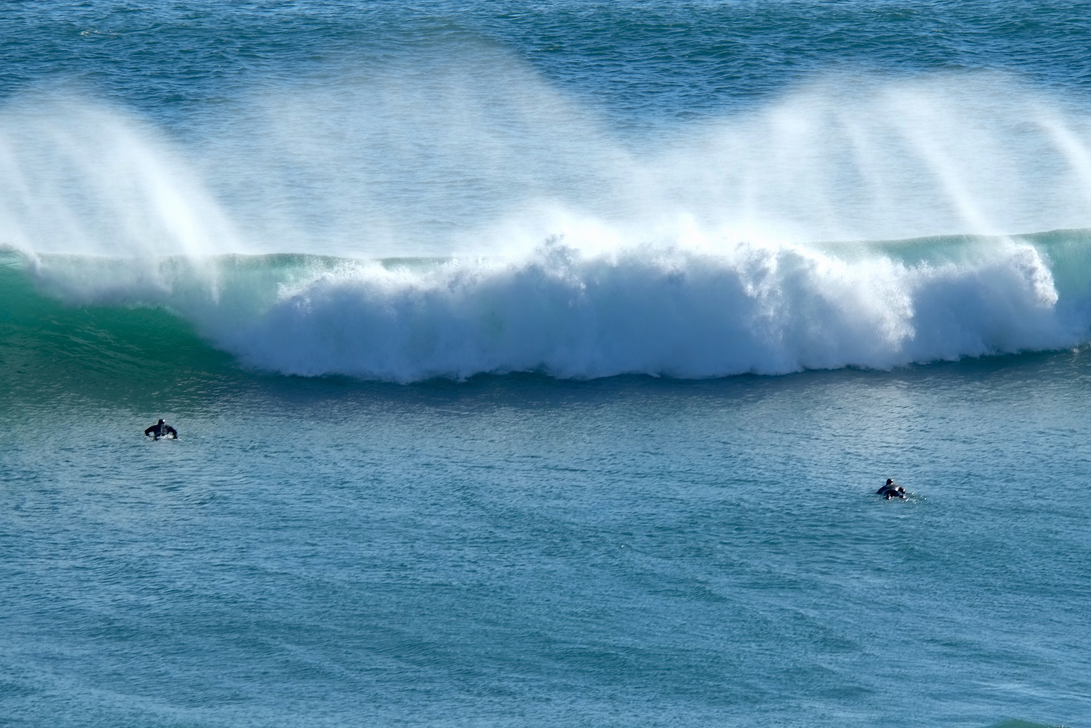 Two Robs paddle back out near Anatori, Anatori River