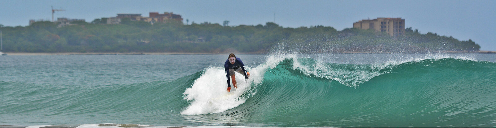 Patrick Mihalic catching a good wave in Playa Grande