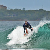 Patrick Mihalic catching a good wave in Playa Grande