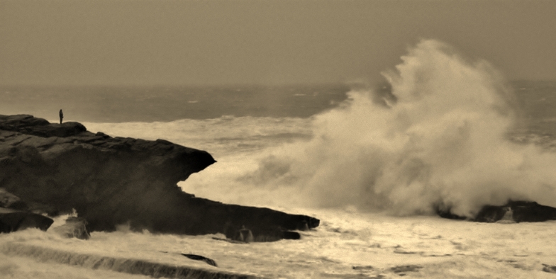 man on rock big swell, St Finan's Bay