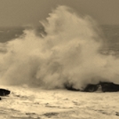 man on rock big swell, St Finan's Bay