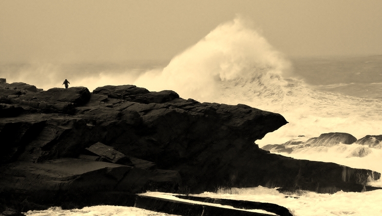 man on rock big swell 2, St Finan's Bay