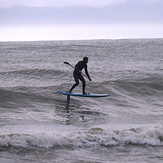 Stand up Paddle Board surfing with a foil at Ruby Bay