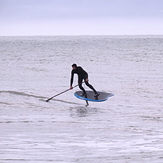 Surfing a SUP with a foil at Ruby Bay