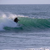 Richard on a nice left at Fossil Point, Farewell Spit