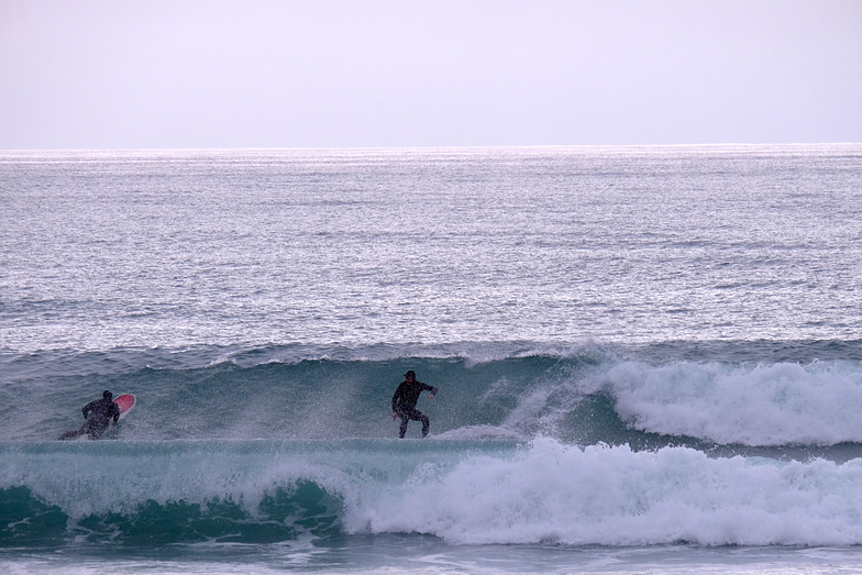 Rob Lewis and Rob Davies enjoy small clean waves at Schnappers, Schnappers Point