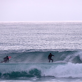 Rob Lewis and Rob Davies enjoy small clean waves at Schnappers, Schnappers Point