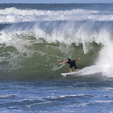 Logan Hayes March 2018, Riomar Reef waves behind