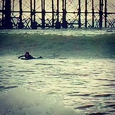 Paddling for a 3ft clean slab, Brighton