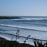 Short-lived early autumn swell at Kumera Patch.