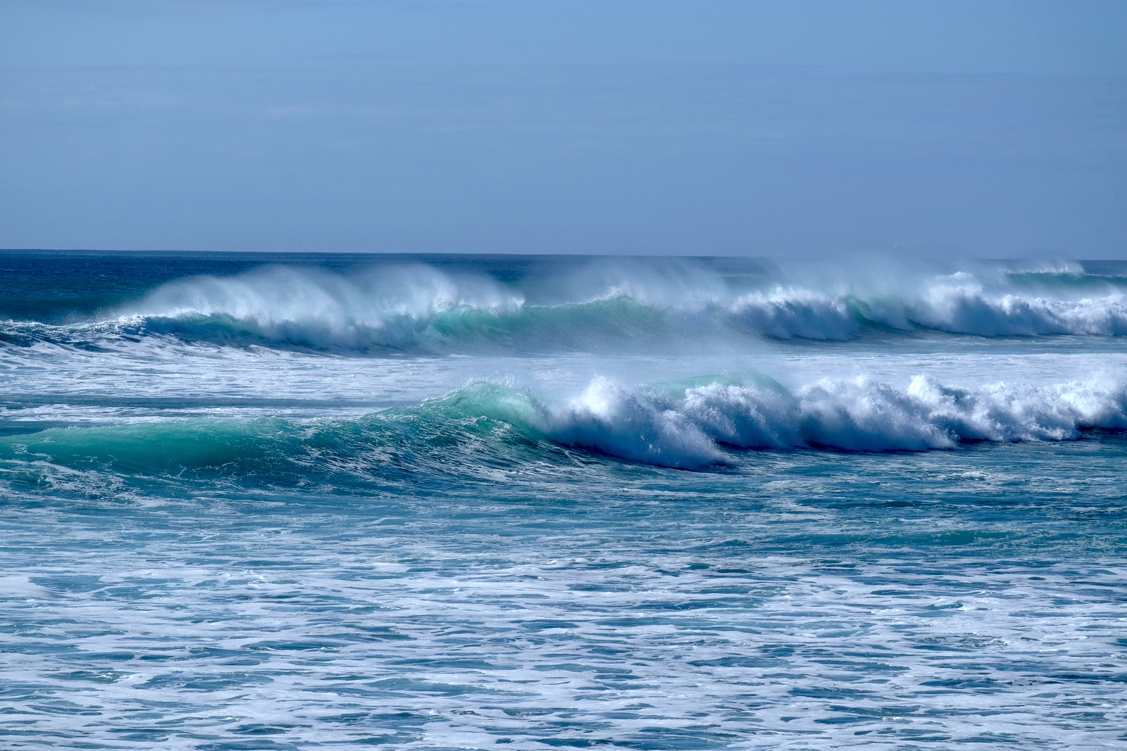 Short-lived early autumn swell at Kumera Patch. As the afternoon tide filled sets started breaking across the bay east of the point.