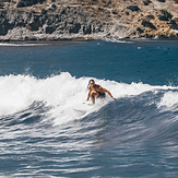 Malta Surf School surf coach Valerio surfing a fun left waves, Ghajn Tuffieha