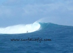 Big wave at Cloudbreak Surfing Fiji photo