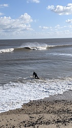 An A-frame cascades onto the sandbanks as the tide drops, Walberswick photo