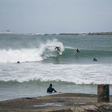 Surfer top turning off left hand point, Lyall Bay