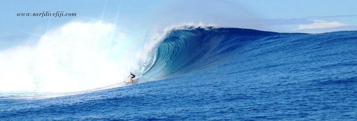 Big wave at Cloudbreak Surfing Fiji