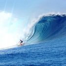 Big wave at Cloudbreak Surfing Fiji