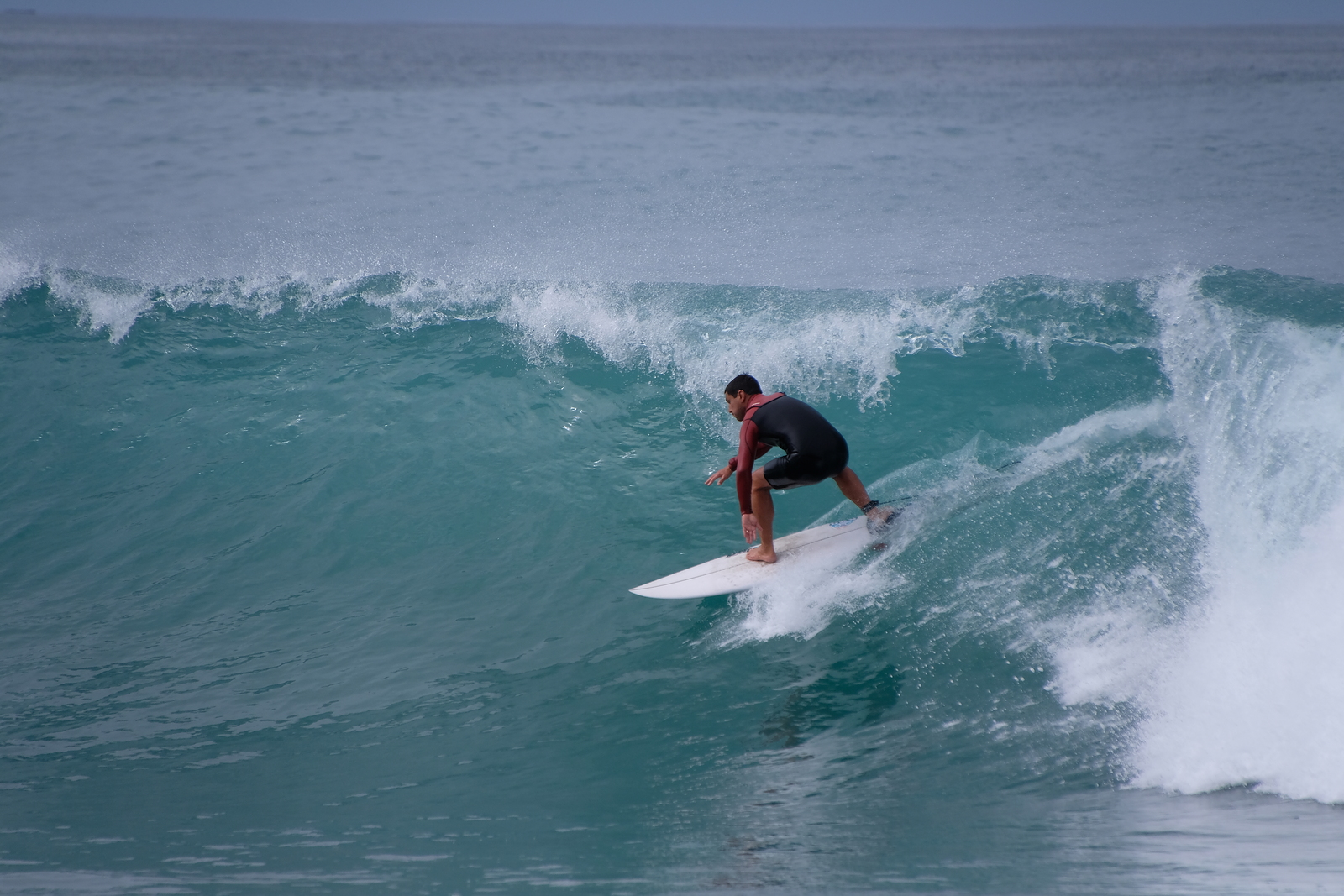 Surfing at Kahutara