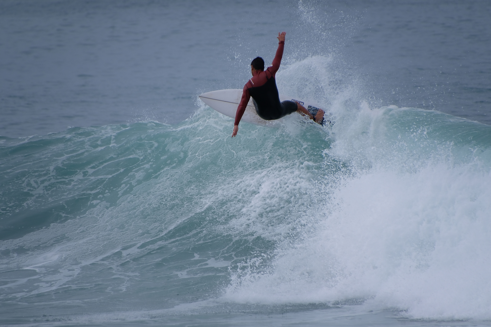 Surfing at Kahutara
