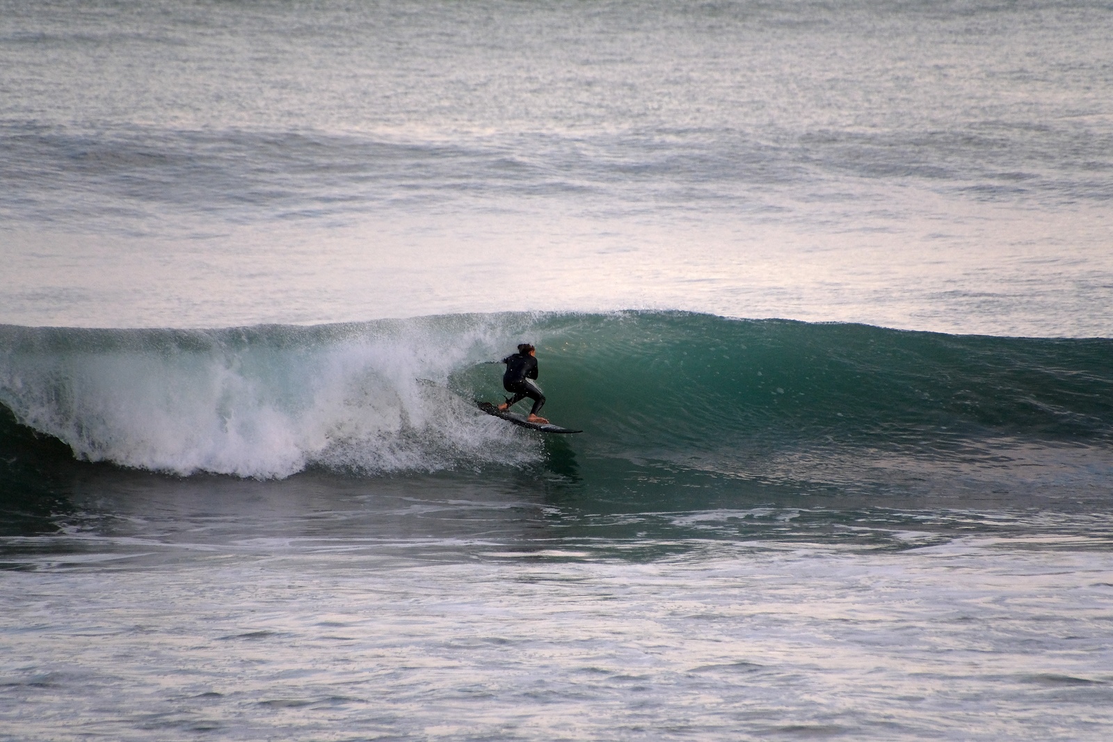 Evening glassy surf session at Whales, Wainui Beach - Whales