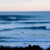 Evening glassy surf at Wainui Beach, Wainui Beach - Whales