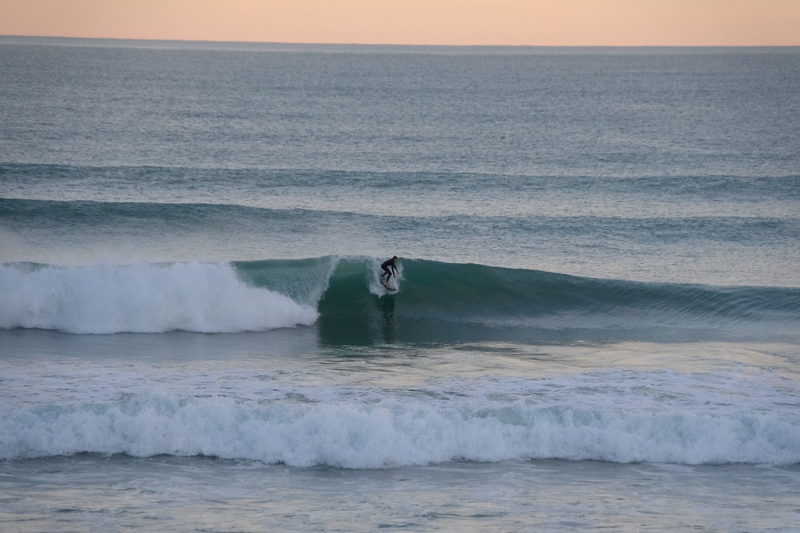 Evening glassy surf at Wainui Beach, Wainui Beach - Whales