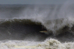 Tube ride - Hurricane Irene swell, St Augustine Beach Pier photo