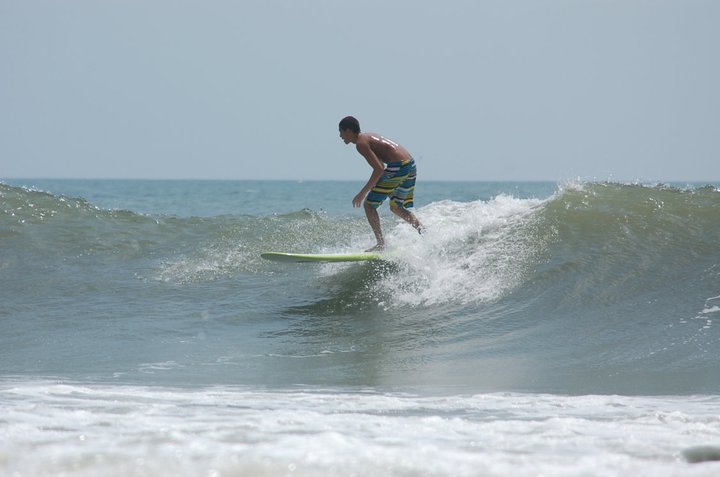 john q rips a right hander on trey whites longboard, North Myrtle/27th Avenue South