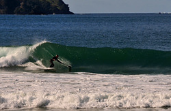 Al from Russell cranking off a sweet left-hand peak, Matauri Bay photo