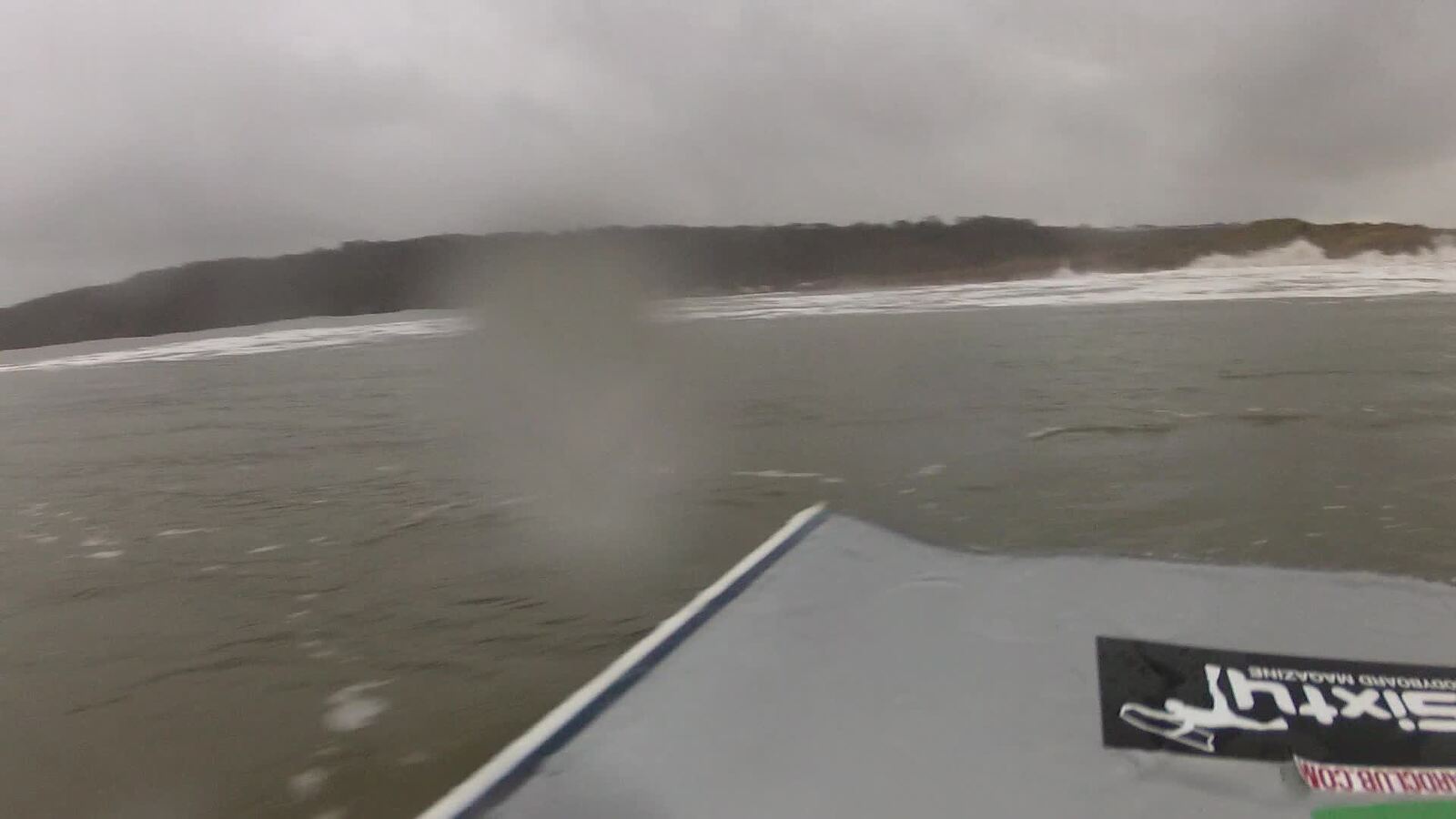 waves breaking over dunes, Oxwich Bay