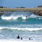 Summer crowd at the Wall, Lyall Bay