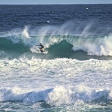 Surfer taking on Soldiers point, Soldiers Beach